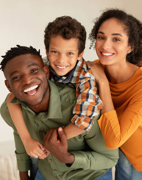 Young, happy African American family with beautiful white teeth